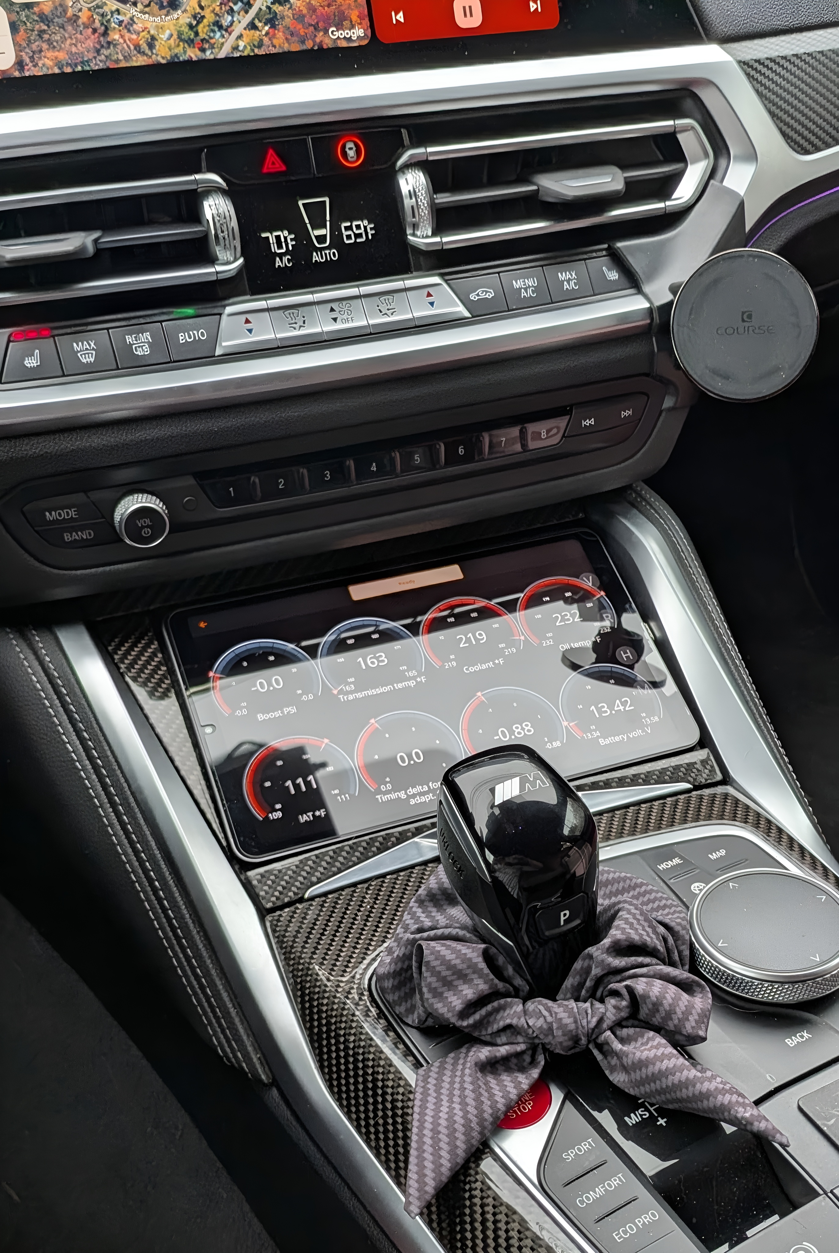 DV-001 interior — carbon console, data logging tablet, M shift knob